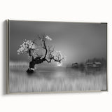 Framed canvas wall art showcasing a serene lake landscape in soft blues and greens, accented with a silver frame, ideal for home décor. Perfect for nature lovers.