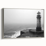 Framed canvas wall art showcasing a serene lighthouse design with a coastal landscape, featuring a silver frame and vibrant colors, ideal for nautical-themed decor.
