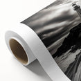 Vibrant rolled canvas artwork showcasing a scenic lighthouse landscape, perfect for home decor, featuring soft blues and warm sunset hues in a protective cardboard tube.
