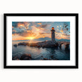 Framed wall art featuring a serene lighthouse landscape design, showcasing vibrant colors and details, set in a sleek black frame with a mat, ideal for coastal-themed decor.