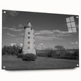 Acrylic glass wall art showcasing a serene lighthouse landscape design, viewed from the side, elegantly mounted with pins, perfect for coastal-themed decor.