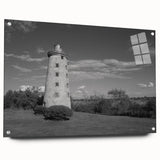 Acrylic glass wall art showcasing a serene lighthouse landscape design, viewed from the side, elegantly mounted with pins, perfect for coastal-themed decor.