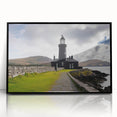 Framed wall art showcasing a serene lighthouse design set against a vibrant sunset, featuring black framing and acrylic glass for a modern touch. Ideal for coastal-themed decor.