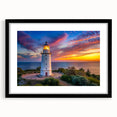 Framed wall art featuring a serene lighthouse landscape design with a black mat and frame, perfect for coastal-themed decor and home styling.
