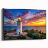 Framed canvas wall art showcasing a black lighthouse design against a serene landscape background, perfect for coastal-themed home decor. The artwork is presented in a sleek frame, enhancing its visual appeal and making it an ideal addition to nautical or beach-inspired interiors.