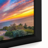 Close-up of a framed canvas wall art featuring a serene lighthouse design, showcasing vibrant blues and whites, ideal for coastal-themed decor.