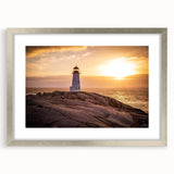 Framed wall art featuring a serene lighthouse landscape design with a silver mat, showcasing vibrant colors and intricate details, ideal for coastal decor.