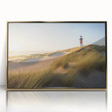 Framed wall art design showcasing a lighthouse in a serene landscape, with a gold-acrylic finish, perfect for coastal-themed home decor. Emphasizes tranquility and elegance in interior design.