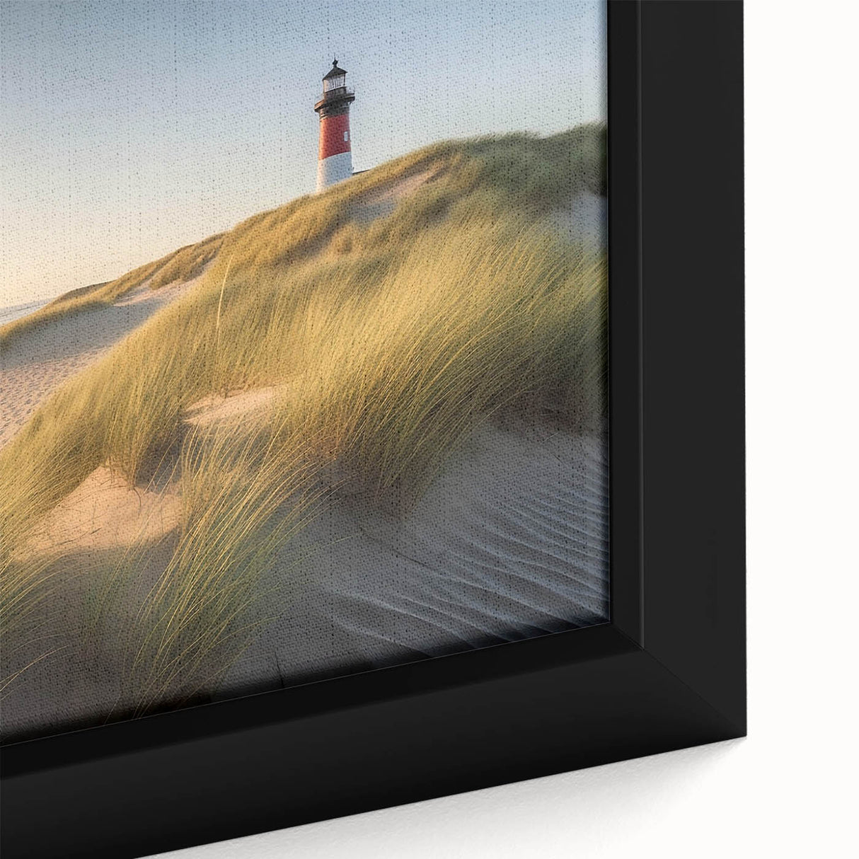Close-up of a framed canvas wall art piece depicting a serene lighthouse landscape, featuring vibrant colors and intricate details, perfect for coastal home decor.