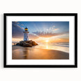 Framed wall art collection showcasing a scenic lighthouse landscape, featuring a black mat and sleek frame, ideal for enhancing coastal-themed decor.