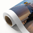Rolled canvas art showcasing a serene coastal landscape with a lighthouse, featuring vibrant colors and fine details, suitable for home decor enhancement.