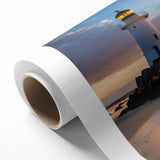 Rolled canvas art showcasing a serene coastal landscape with a lighthouse, featuring vibrant colors and fine details, suitable for home decor enhancement.