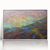 Framed acrylic wall art depicting a serene marsh landscape with lush greenery and soft water reflections, presented in a sleek white frame, perfect for nature-inspired decor.