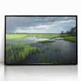 Framed acrylic wall art featuring a serene marsh landscape with lush greenery and soft reflections on water, presented in a sleek black frame. Ideal for nature enthusiasts.