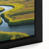 Close-up of a framed canvas wall art piece depicting a serene marsh landscape, showcasing vibrant greenery and soft, reflective water, perfect for nature lovers.
