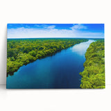 Stretched canvas wall art depicting a serene marsh landscape with lush greenery and tranquil water reflections, perfect for enhancing interior decor.