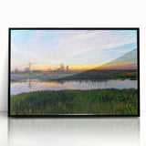 Framed wall art featuring a vibrant landscape of a marshy swamp, showcasing rich green foliage and shimmering water under a clear blue sky, ideal for nature enthusiasts.