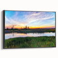 Framed canvas wall art showcasing a serene marsh landscape with vibrant greenery and a tranquil waterway, designed to enhance home decor with nature-inspired aesthetics.
