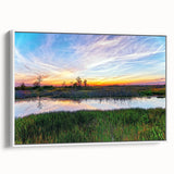 Framed canvas wall art depicting a serene marsh landscape with vibrant greens and blues, perfect for adding a nature-inspired touch to any space.