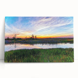 Stretched canvas wall art showcasing a serene marsh landscape with vibrant greens and blues, perfect for enhancing any home decor. Ideal for nature lovers and art enthusiasts.