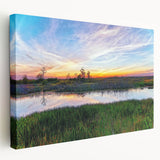 Stretched canvas wall art showcasing a serene marsh landscape with lush greenery and reflective water, perfect for nature enthusiasts and home decor.