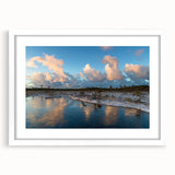 Framed wall art featuring a serene marsh landscape with lush greenery and soft water reflections, designed to enhance home decor with nature-inspired aesthetics. The white mat adds a modern touch, perfect for living spaces or offices.