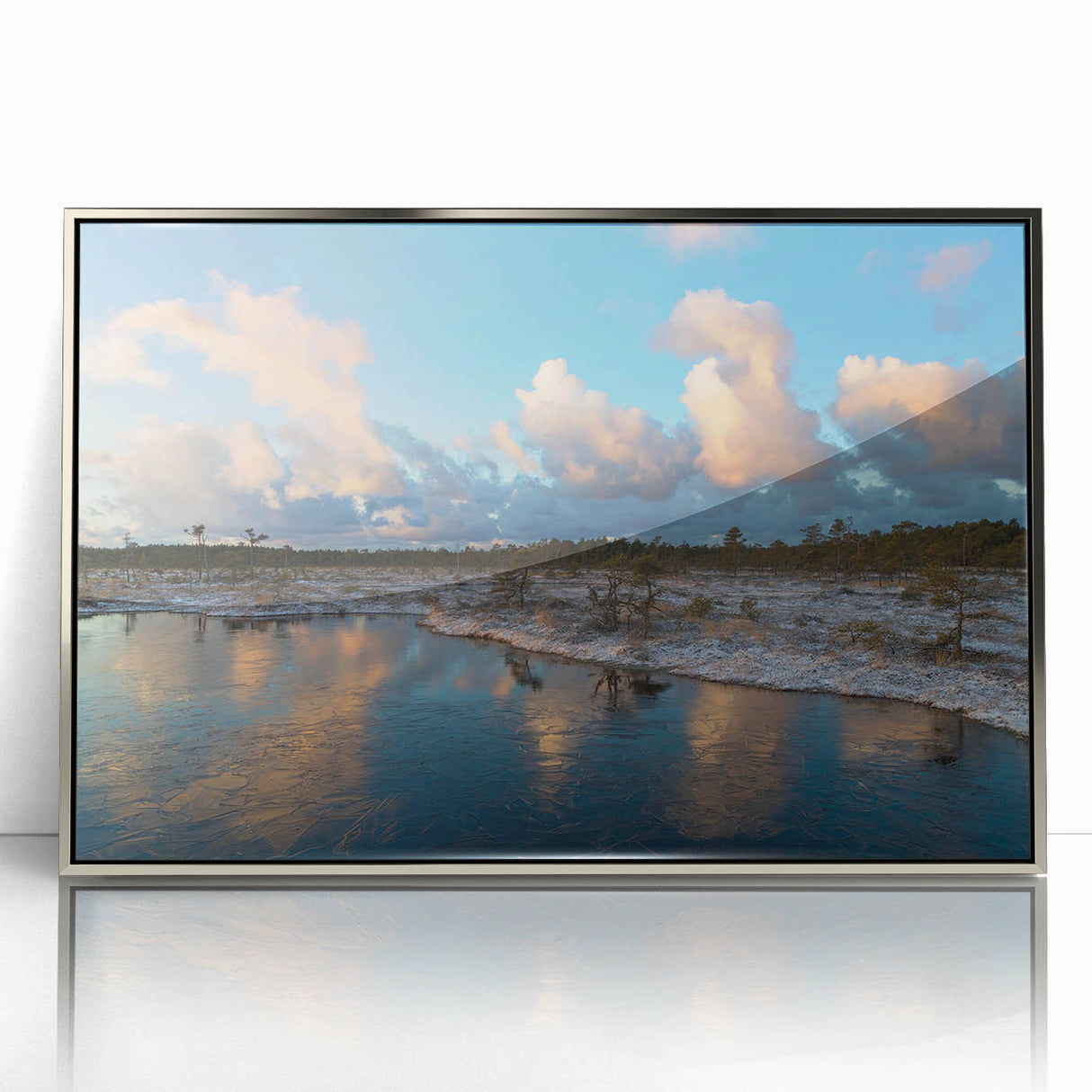 Framed wall art showcasing a serene marsh landscape with lush greenery and reflective water, featuring a silver-accented frame that enhances its natural beauty. Perfect for home decor.