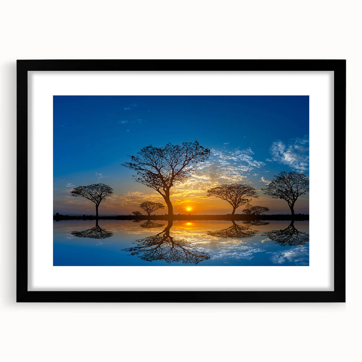 Black-framed wall art depicting a serene marsh landscape with lush greenery and a reflective swamp, elegantly designed for modern home decor. Perfect for nature enthusiasts.