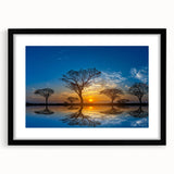 Black-framed wall art depicting a serene marsh landscape with lush greenery and a reflective swamp, elegantly designed for modern home decor. Perfect for nature enthusiasts.