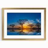 Framed wall art showcasing a serene marsh landscape with lush greenery and a tranquil water body, enhanced by a gold mat and frame, perfect for home decor.