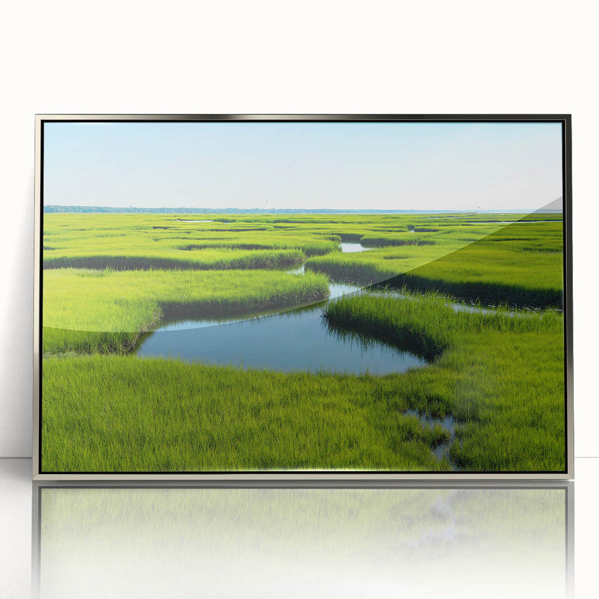 Framed wall art collection showcasing a serene marsh landscape with lush greenery and reflections, encased in a sleek silver frame for modern decor.