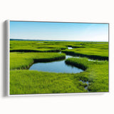 Framed canvas wall art depicting a serene marsh landscape with lush greenery and reflections in water, ideal for nature-inspired home decor.