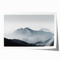 Rolled print of a serene landscape featuring misty fog enveloping a tranquil forest scene, ideal for home decor, showcasing soft greens and blues for a calming effect.