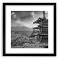 Framed landscape wall art featuring majestic mountains in shades of blue and gray, with a sleek black mat and frame, ideal for modern home decor.