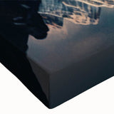 Close-up of a stretched canvas wall art piece depicting serene mountain landscapes with vibrant colors, designed to enhance home decor and create a calming atmosphere.