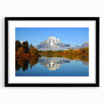 Framed landscape wall art collection showcasing majestic mountains in vibrant colors, featuring a sleek black frame and mat. Ideal for home decor enthusiasts.