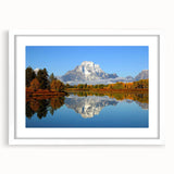 Framed wall art featuring a stunning mountain landscape design, presented in a white mat and frame, perfect for enhancing home decor and adding a serene touch to any space.