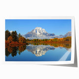 Vibrant rolled print of mountain landscapes showcasing stunning natural scenery with rich colors, perfect for home decor or office wall art collection.
