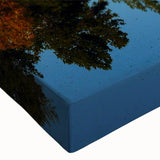 Vibrant close-up of a stretched canvas wall art piece showcasing majestic mountain landscapes, featuring rich colors and intricate details ideal for home decor.