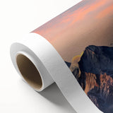 Rolled canvas showcasing a vibrant mountain landscape design, featuring rich colors and intricate details, perfect for home decor or office art display.