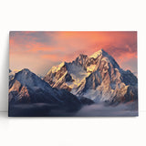 Stretched canvas wall art featuring a serene landscape of majestic mountains with a vibrant sunset, ideal for enhancing home decor or creating a calming atmosphere.
