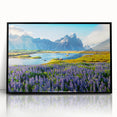 Framed wall art of majestic mountains in a minimalist black frame, showcasing vibrant colors and intricate details, perfect for enhancing any modern decor.