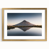 Framed wall art showcasing a stunning mountain landscape design with a gold mat, perfect for home decor, adding elegance and charm to any space.