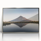 Framed wall art showcasing a stunning mountain landscape design with rich colors and intricate details, featuring a modern silver frame, perfect for home decor.