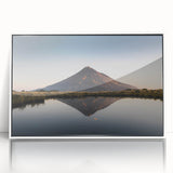 Framed wall art featuring a stunning landscape of mountains in a white frame, showcasing vibrant colors and intricate details, perfect for home decor.