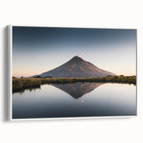 Framed canvas wall art depicting a serene mountain landscape, featuring soft blue and grey hues with white borders, ideal for home decor and nature lovers.