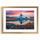 Elegant gold-framed wall art showcasing a majestic mountain landscape, designed for home decor, featuring rich colors and a sophisticated mat for an upscale aesthetic.