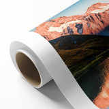 Mountain landscape wall art design on rolled canvas, showcasing vibrant colors and intricate details of majestic peaks under a clear blue sky, ideal for home decor.