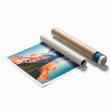 Mountain landscape wall art print showcasing dramatic peaks and vibrant sunset colors, rolled for easy shipping and display in various settings.