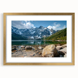 Framed wall art depicting a stunning mountain landscape in soft pastel colors, featuring a decorative gold frame and mat, perfect for home decor.